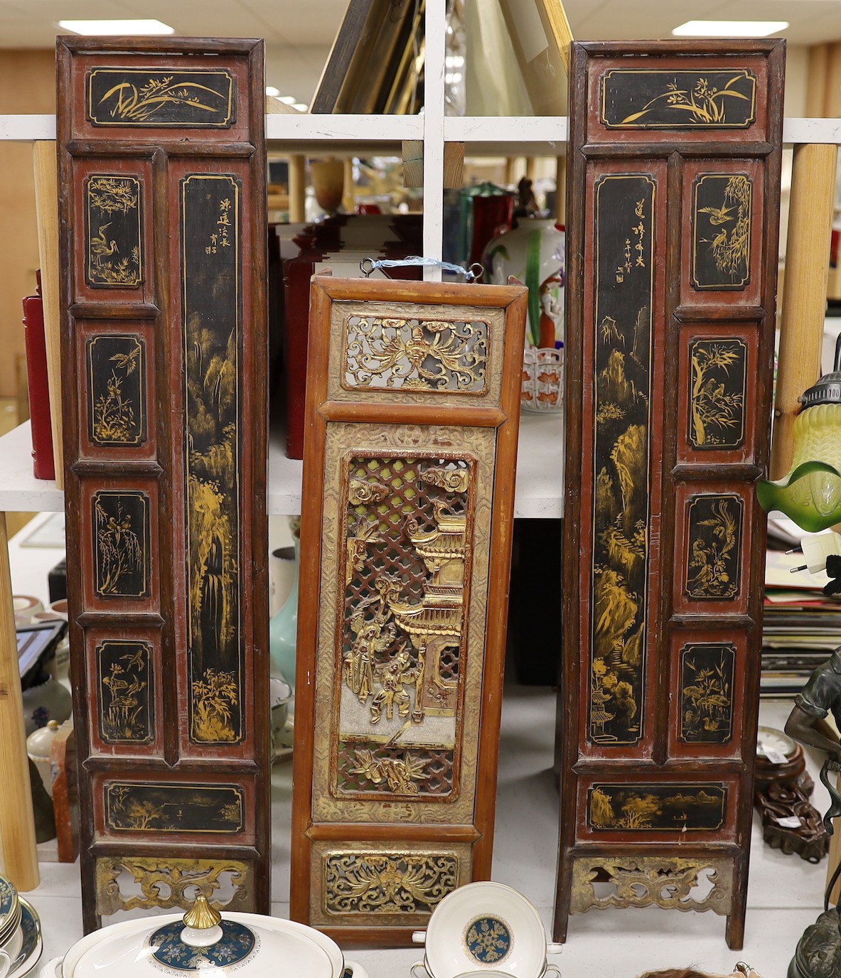A pair of late 19th century Chinese gilt-decorated lacquer panels and a similar smaller rectangular pierced panel, tallest 91cms high